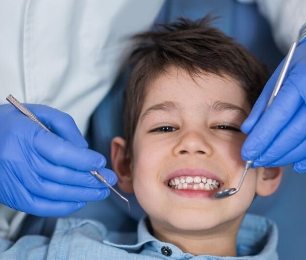 little-boy-regular-dental-checkup_798657-829
